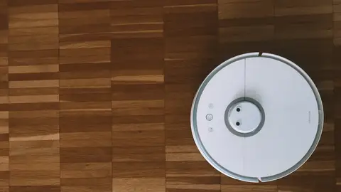 Un robot aspirador Un robot aspirador