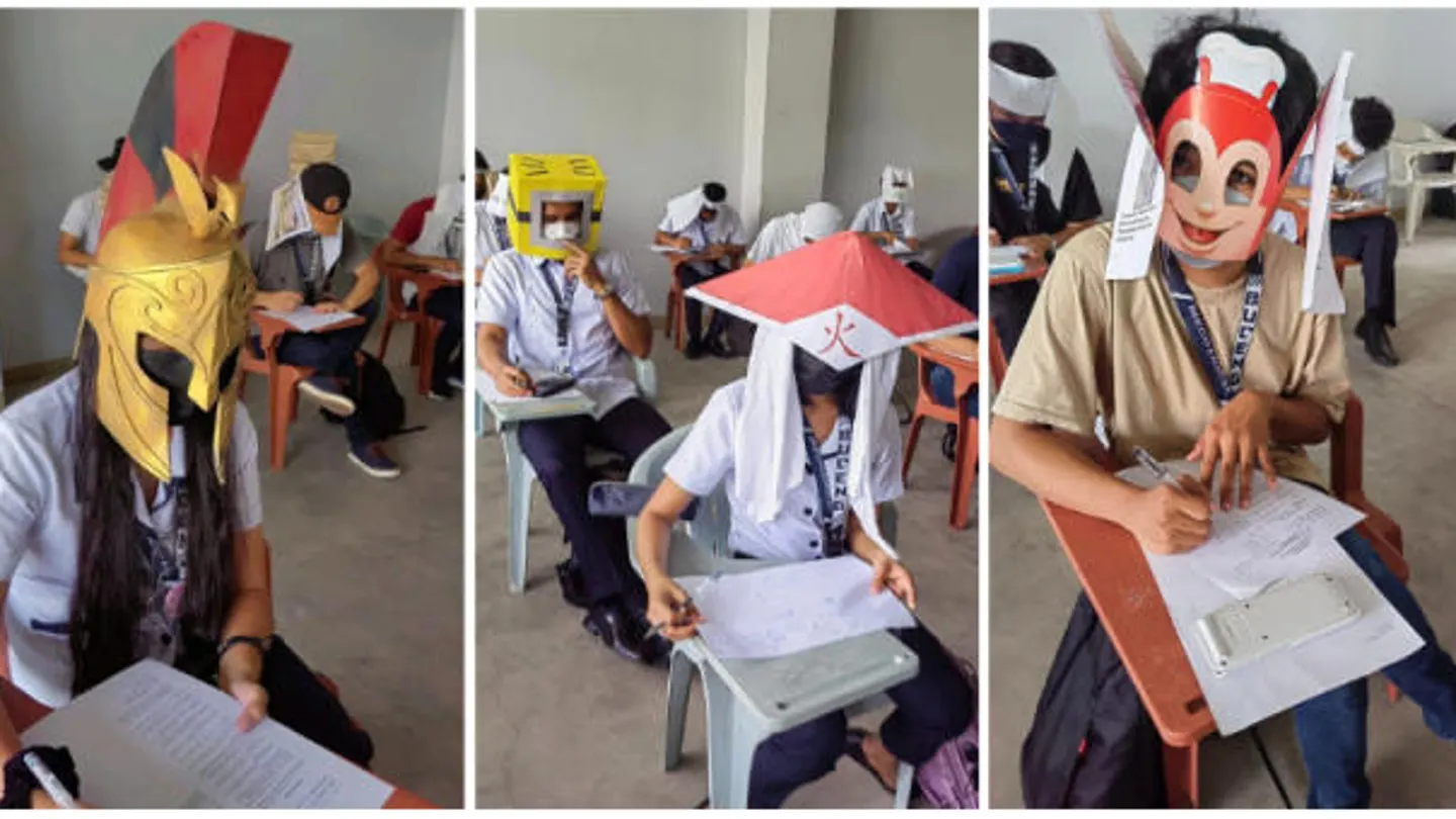 Usan sombreros para evitar copiar en exámenes Usan sombreros para evitar copiar en exámenes